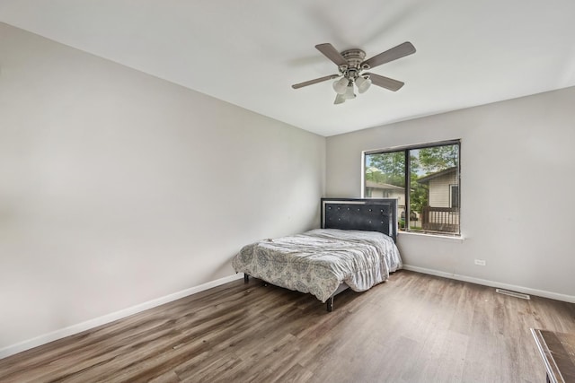 1340 Kingsbury Dr Unit 2, Hanover Park, IL 60133 - bedroom with wood finished floors and ceiling fan