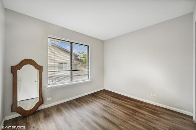 1340 Kingsbury Dr Unit 2, Hanover Park, IL 60133 - unfurnished room featuring wood finished floors and baseboards