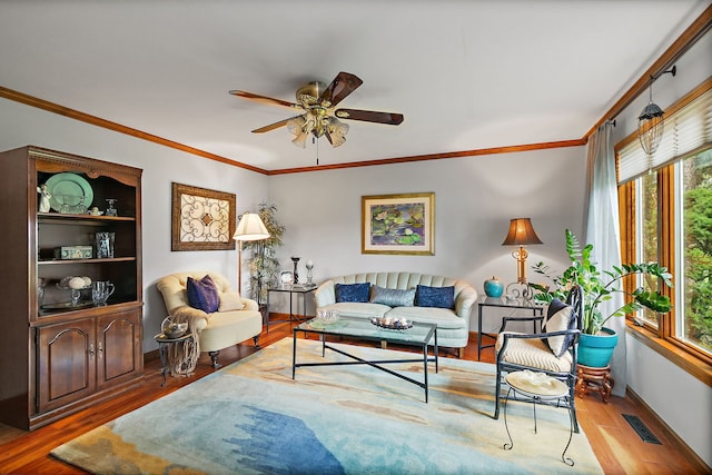 1606 Gregden Shores Dr, Sterling, IL 61081 - living room featuring crown molding, healthy amount of natural light, wood finished floors, and ceiling fan