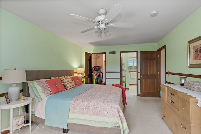 1606 Gregden Shores Dr, Sterling, IL 61081 - bedroom featuring light carpet, a spacious closet, and a ceiling fan