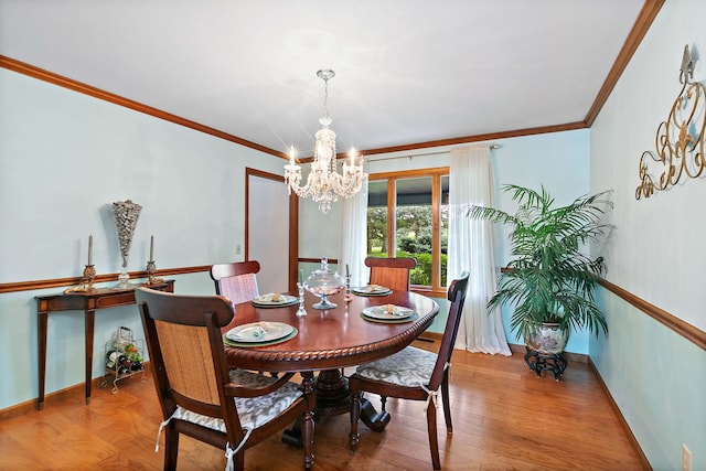 1606 Gregden Shores Dr, Sterling, IL 61081 - dining space featuring a chandelier, ornamental molding, and wood finished floors