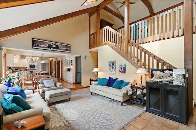 1606 Gregden Shores Dr, Sterling, IL 61081 - living room with high vaulted ceiling, a chandelier, beamed ceiling, stairway, and a ceiling fan
