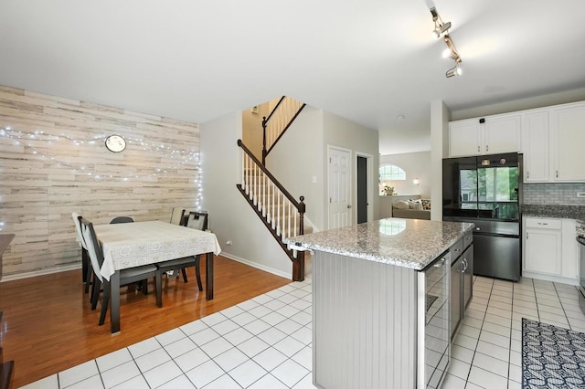 186 Willow Blvd, Willow Springs, IL 60480 - kitchen with smart refrigerator, light tile patterned flooring, wine cooler, light stone countertops, and a kitchen island