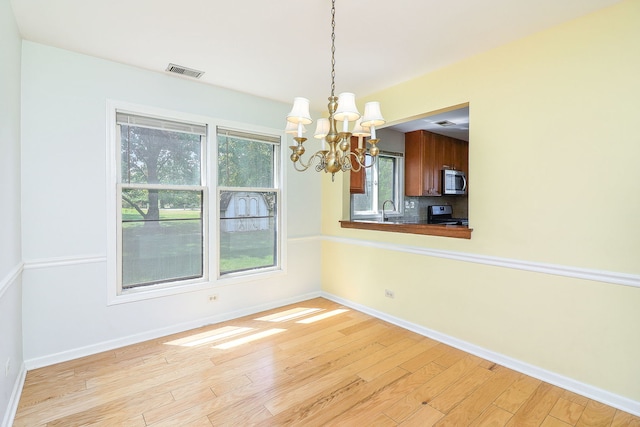 1918 N Yale Ave, Arlington Heights, IL 60004 - unfurnished dining area with a chandelier and light wood finished floors