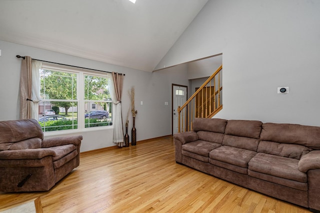5505 Salma St, Plainfield, IL 60586 - living area with stairway, light wood finished floors, and high vaulted ceiling