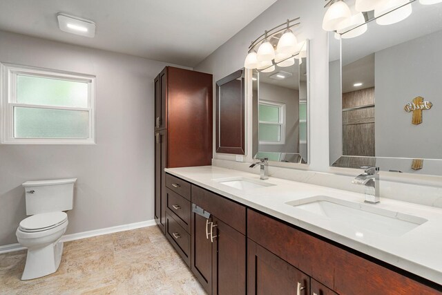 5505 Salma St, Plainfield, IL 60586 - bathroom featuring double vanity, plenty of natural light, and tiled shower