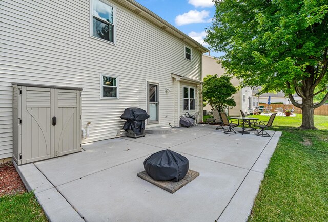 5505 Salma St, Plainfield, IL 60586 - back of house with a lawn and a patio area