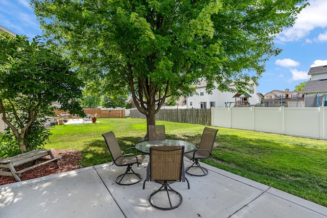 5505 Salma St, Plainfield, IL 60586 - fenced backyard featuring a patio, outdoor dining area, and a residential view
