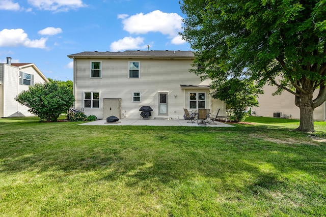 5505 Salma St, Plainfield, IL 60586 - rear view of property with a patio area and a lawn