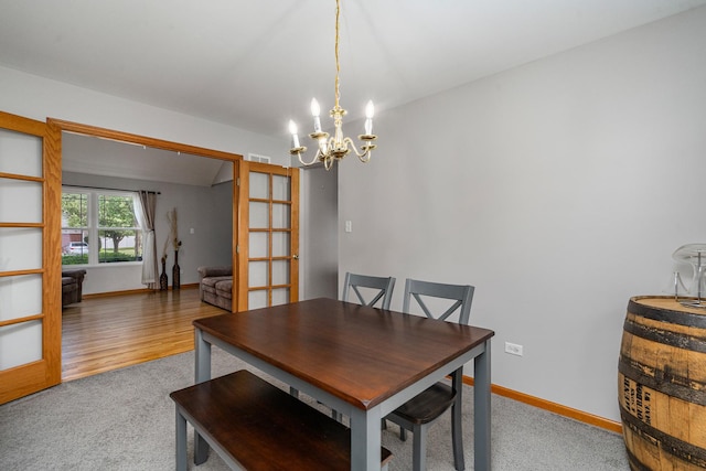 5505 Salma St, Plainfield, IL 60586 - dining space with a chandelier and carpet flooring