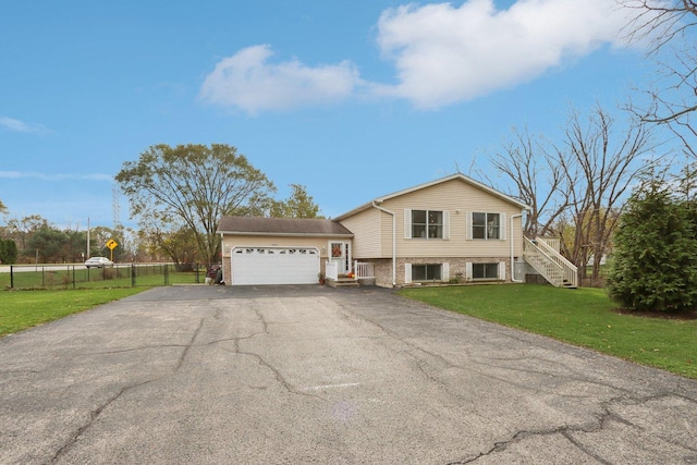 9997 W Paddock Ave, Beach Park, IL 60087 - split level home featuring driveway, a garage, brick siding, and stairway