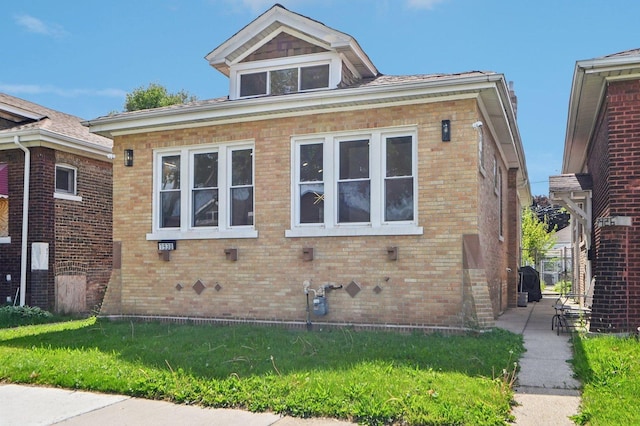 7930 S Kenwood Ave, Chicago, IL 60619 - view of property exterior featuring brick siding and a lawn