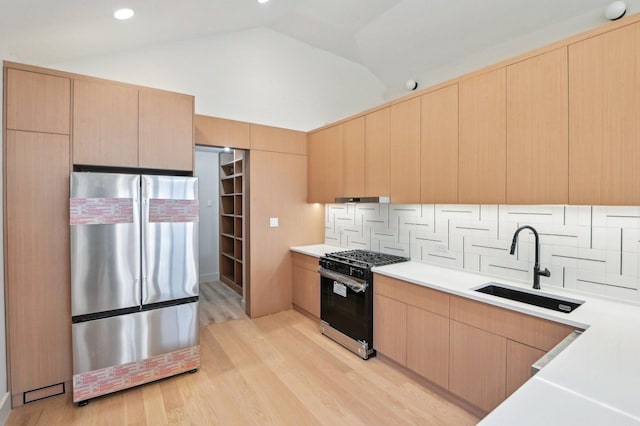 7930 S Kenwood Ave, Chicago, IL 60619 - kitchen featuring freestanding refrigerator, gas stove, tasteful backsplash, light wood finished floors, and light countertops