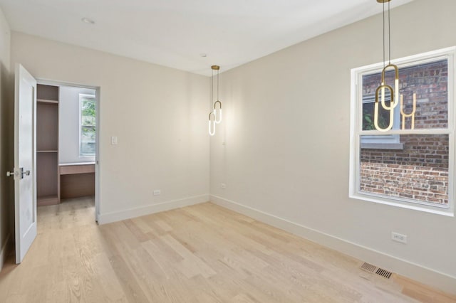7930 S Kenwood Ave, Chicago, IL 60619 - unfurnished room featuring light wood-type flooring and baseboards