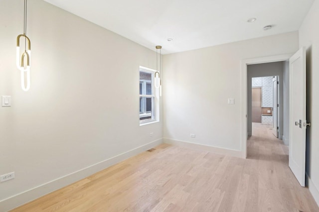 7930 S Kenwood Ave, Chicago, IL 60619 - spare room featuring light wood-style floors and baseboards