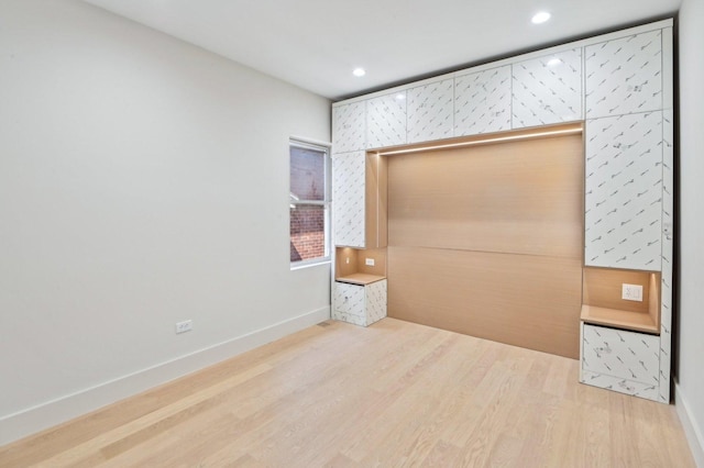 7930 S Kenwood Ave, Chicago, IL 60619 - unfurnished bedroom with wood finished floors and recessed lighting