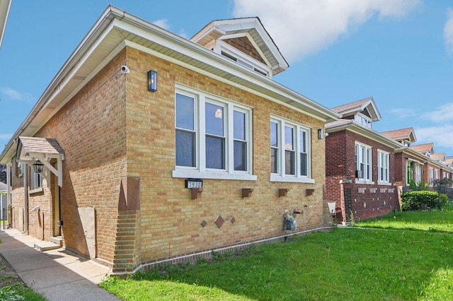 7930 S Kenwood Ave, Chicago, IL 60619 - view of side of home featuring a lawn and brick siding