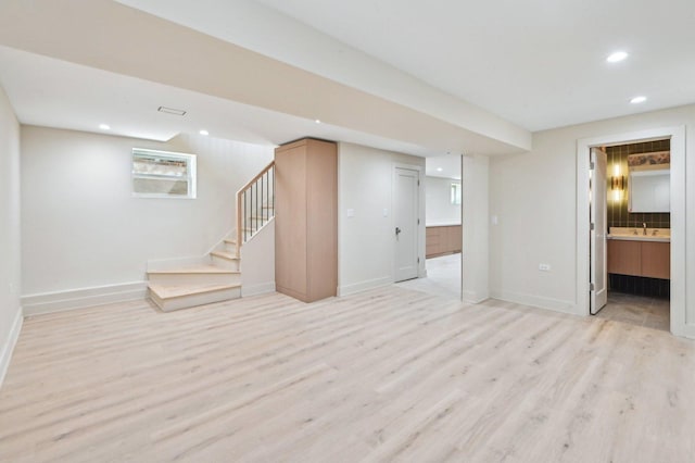 7930 S Kenwood Ave, Chicago, IL 60619 - below grade area featuring light wood-style floors, recessed lighting, and stairway