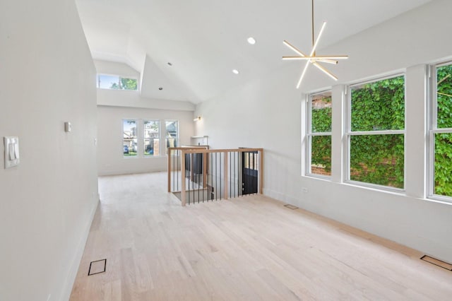7930 S Kenwood Ave, Chicago, IL 60619 - empty room with wood finished floors, high vaulted ceiling, and recessed lighting