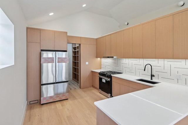 7930 S Kenwood Ave, Chicago, IL 60619 - kitchen featuring freestanding refrigerator, black gas stove, light countertops, light wood finished floors, and backsplash
