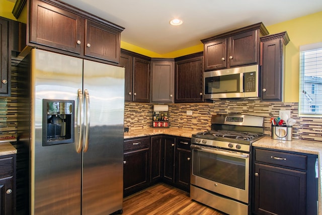 1670 Windward Dr, Pingree Grove, IL 60140 - kitchen with stainless steel appliances, dark wood finished floors, dark brown cabinetry, tasteful backsplash, and recessed lighting