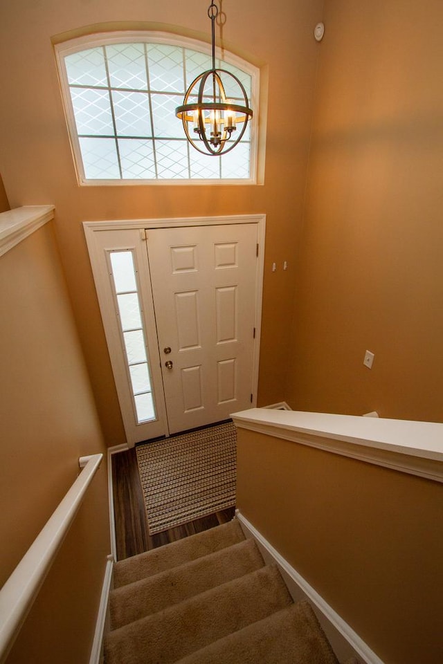 1670 Windward Dr, Pingree Grove, IL 60140 - entrance foyer with healthy amount of natural light, stairs, and a chandelier