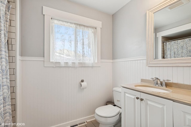 1308 Hoffman Ave, Park Ridge, IL 60068 - full bath featuring a wainscoted wall, vanity, and a shower with shower curtain