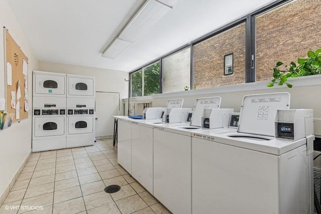 1450 N Astor St Unit 14D, Chicago, IL 60610 - shared laundry with washing machine and clothes dryer, estacked washer and dryer, and light tile patterned floors