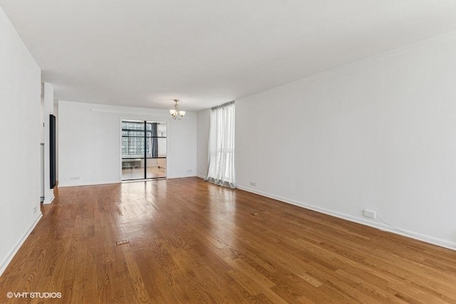 1450 N Astor St Unit 14D, Chicago, IL 60610 - unfurnished room featuring a chandelier and wood finished floors