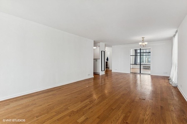1450 N Astor St Unit 14D, Chicago, IL 60610 - unfurnished living room featuring a chandelier and wood finished floors