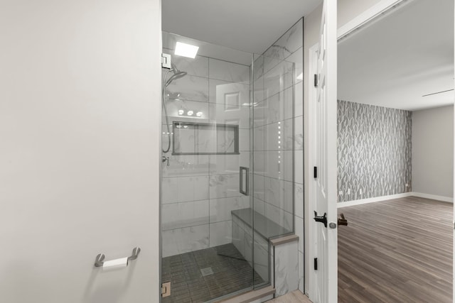 992 Langtry Ct Unit D, Elgin, IL 60120 - bathroom with a stall shower, wood finished floors, and wallpapered walls