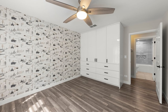 992 Langtry Ct Unit D, Elgin, IL 60120 - unfurnished bedroom with dark wood-style flooring, a closet, and ceiling fan