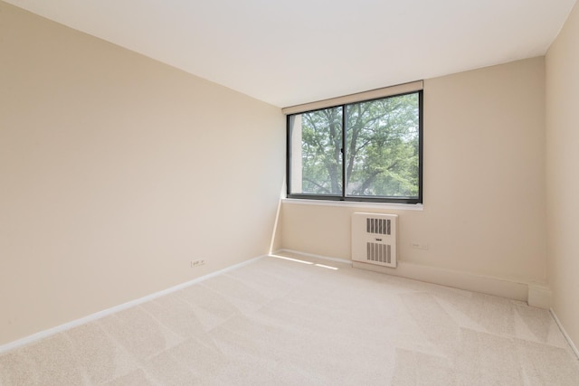 1110 Grove St Unit 4A, Downers Grove, IL 60515 - spare room with light carpet and heating unit
