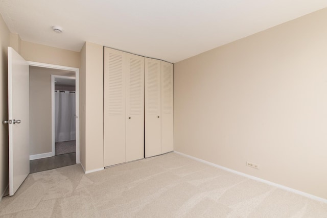 1110 Grove St Unit 4A, Downers Grove, IL 60515 - unfurnished bedroom with light carpet and a closet