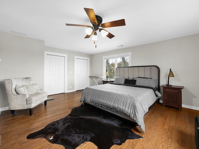 711 Illinois St, Lemont, IL 60439 - bedroom with multiple closets, wood finished floors, and a ceiling fan