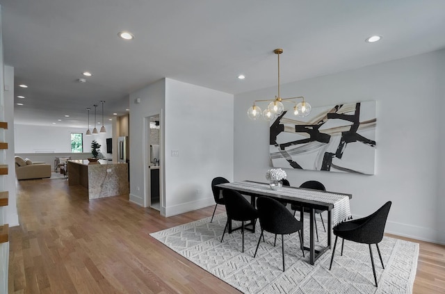 1332 N Leavitt St, Chicago, IL 60622 - dining space featuring recessed lighting, light wood-style flooring, and a chandelier