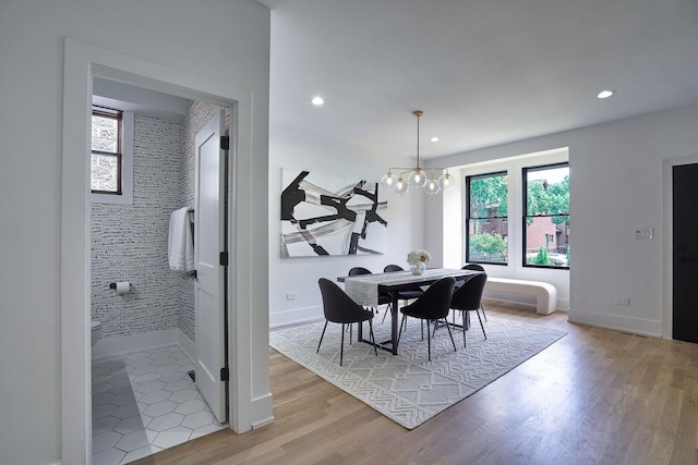 1332 N Leavitt St, Chicago, IL 60622 - dining area with light wood finished floors, a chandelier, and recessed lighting