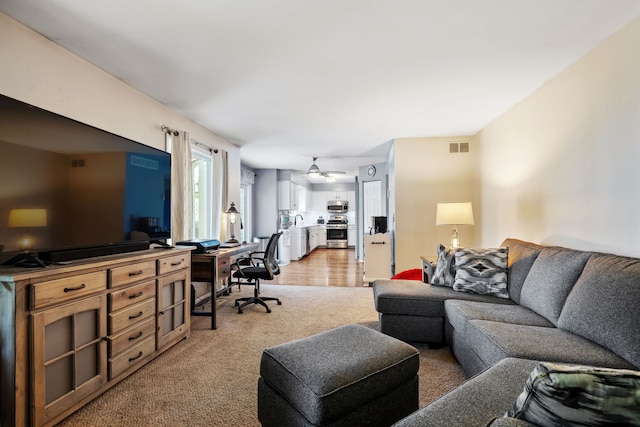 2706 Steamboat Cir, Plainfield, IL 60586 - living area featuring a desk, light colored carpet, and a ceiling fan