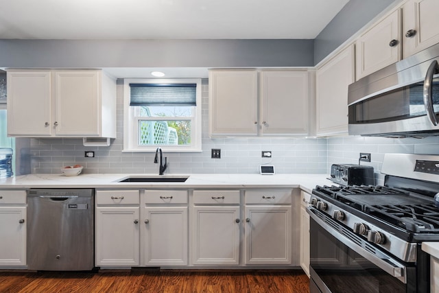 2706 Steamboat Cir, Plainfield, IL 60586 - kitchen with stainless steel appliances, backsplash, white cabinetry, and light countertops