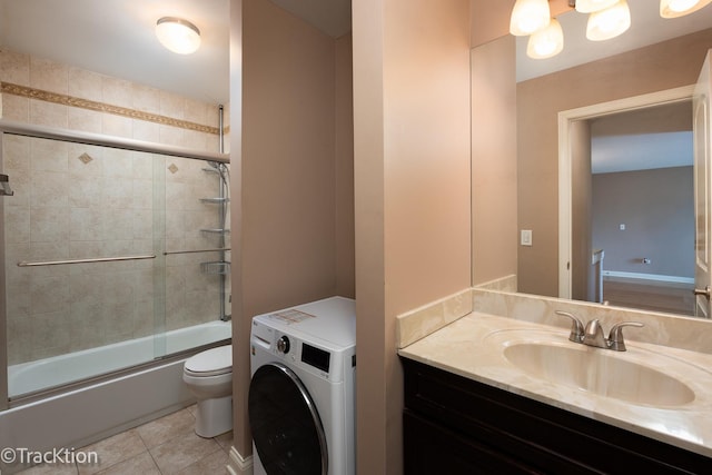 1091 Rodenburg Rd Unit 303, Roselle, IL 60172 - full bathroom with washer / clothes dryer, vanity, enclosed tub / shower combo, and tile patterned floors