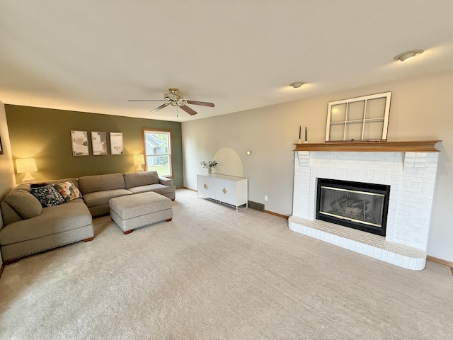 5448 S Branch Ct, Rochelle, IL 61068 - living room featuring carpet floors, a ceiling fan, and a fireplace