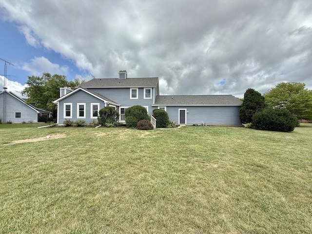 5448 S Branch Ct, Rochelle, IL 61068 - view of front facade with a chimney and a front yard