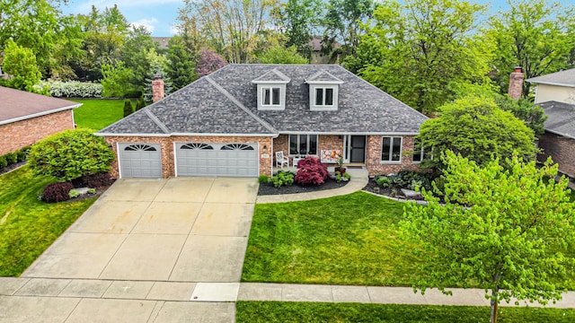 207 Hamilton Ave, Frankfort, IL 60423 - view of front facade with brick siding, an attached garage, concrete driveway, a front yard, and a shingled roof