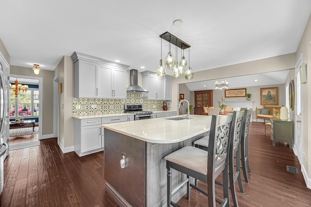 207 Hamilton Ave, Frankfort, IL 60423 - kitchen with wall chimney exhaust hood, electric stove, a chandelier, and dark wood-style floors