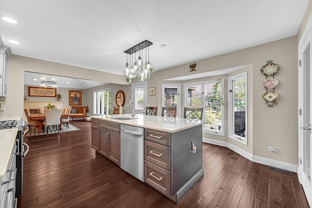 207 Hamilton Ave, Frankfort, IL 60423 - kitchen featuring appliances with stainless steel finishes, a chandelier, light countertops, recessed lighting, and dark wood finished floors