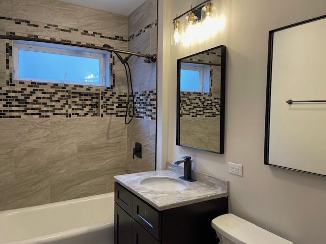 1404 Scoville Ave, Berwyn, IL 60402 - bathroom with bathing tub / shower combination and vanity