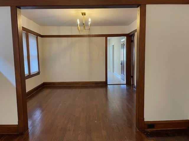 1404 Scoville Ave, Berwyn, IL 60402 - unfurnished dining area with a chandelier and dark wood-style floors