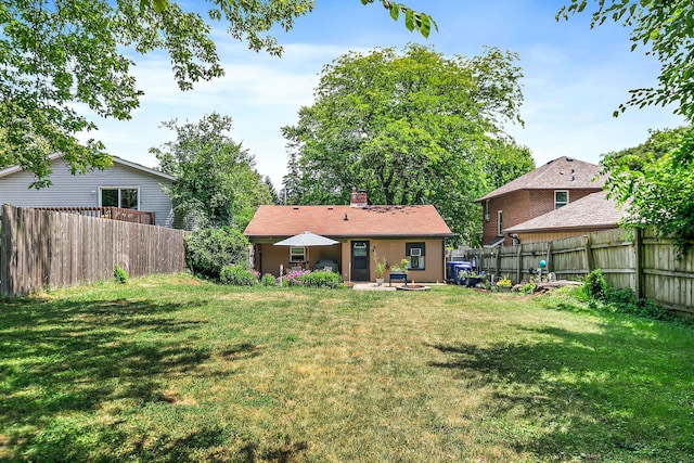 911 N 9th St, Dekalb, IL 60115 - fenced backyard featuring a patio area
