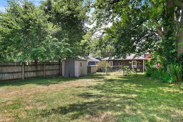 911 N 9th St, Dekalb, IL 60115 - fenced backyard featuring a shed