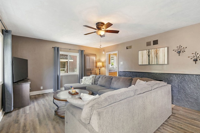 911 N 9th St, Dekalb, IL 60115 - living room featuring ceiling fan and wood finished floors